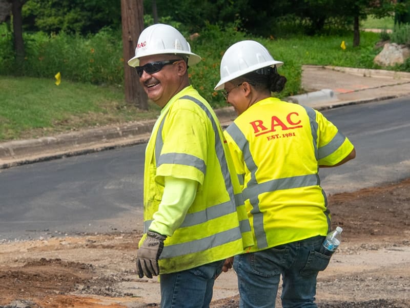 Two RAC field personnel during road reclamation and paving project