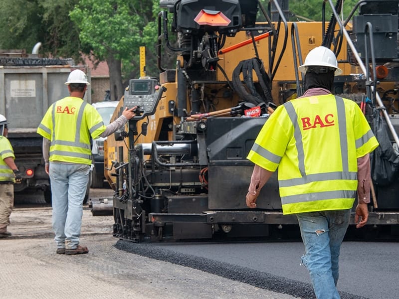 Asphalt paving machine at road construction project in DFW, Texas