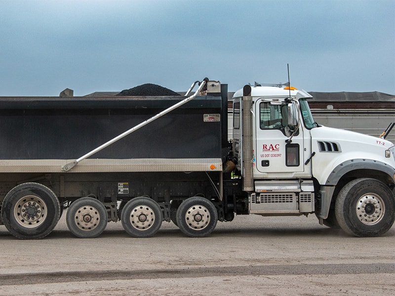 Asphalt truck full of hot asphalt mix at plant in Saginaw, Texas